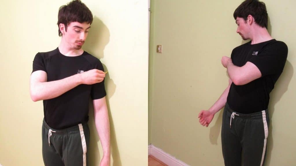 A man showing how to measure your shoulders without a tape measure