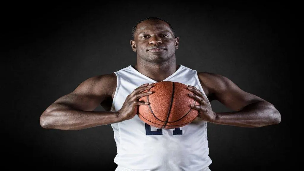 A basketball player showing that he has some of the widest shoulders in the NBA