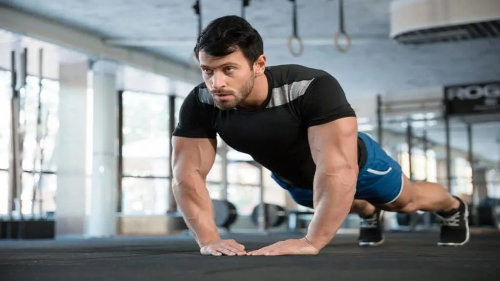 A man with 12 inch wrists doing push-ups