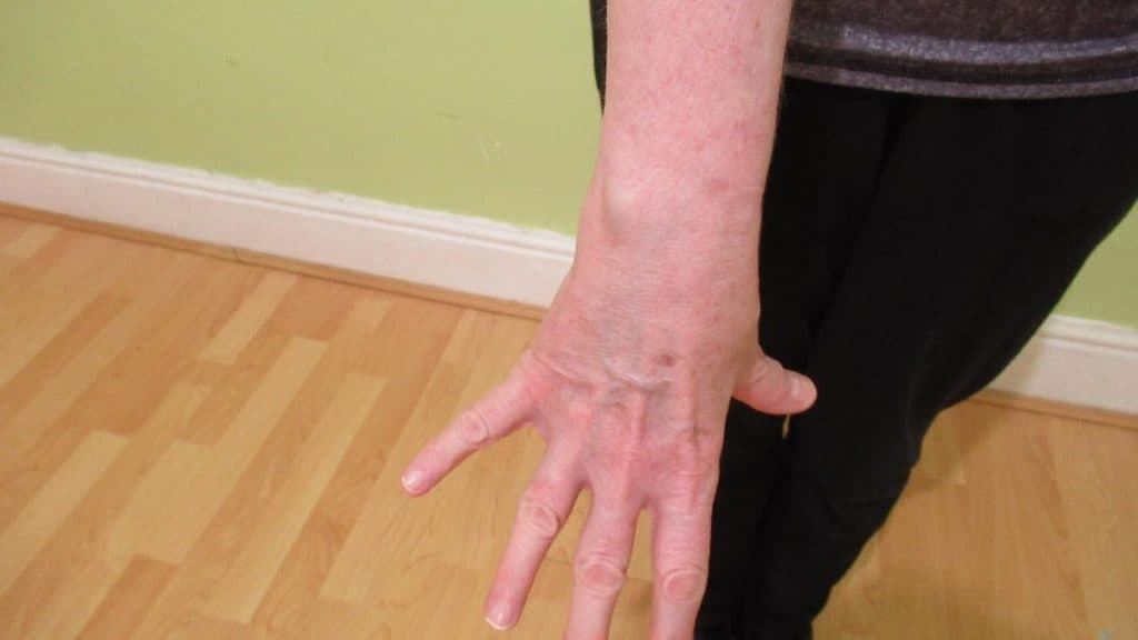 A female showing that she has a 6 inch wrist