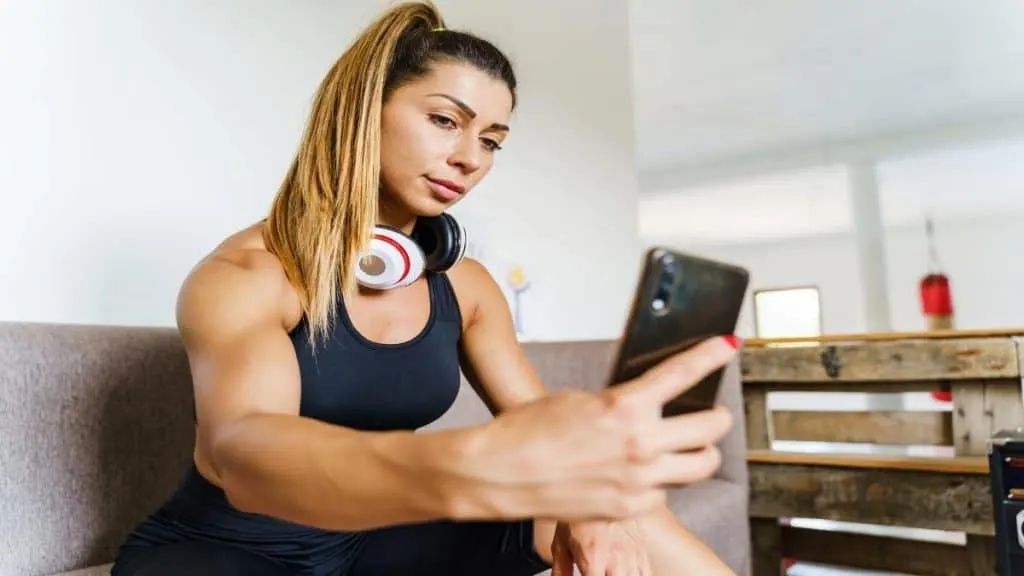 A woman with 6 inch wrists holding her phone