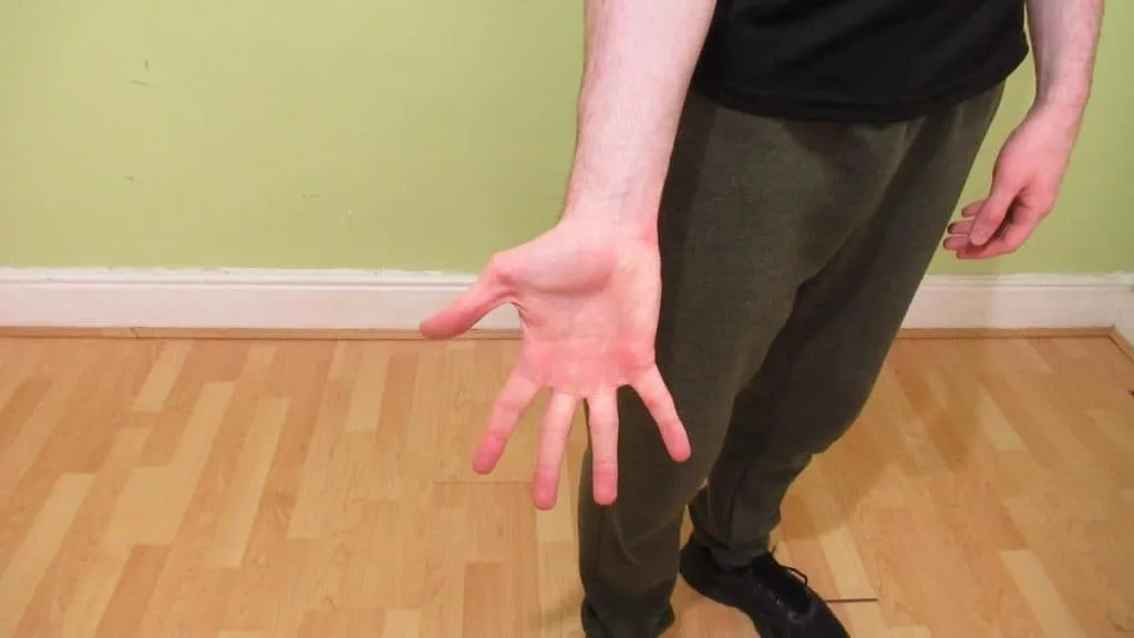 A man showing his 6.7 inch wrist