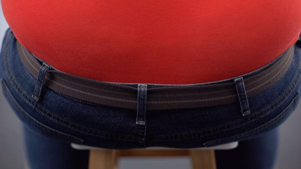 Close up of an overweight man's 63 in hips