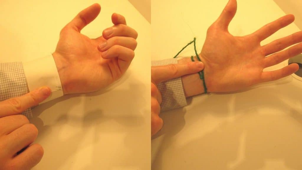 A man showing how to measure your wrist size without a tape measure
