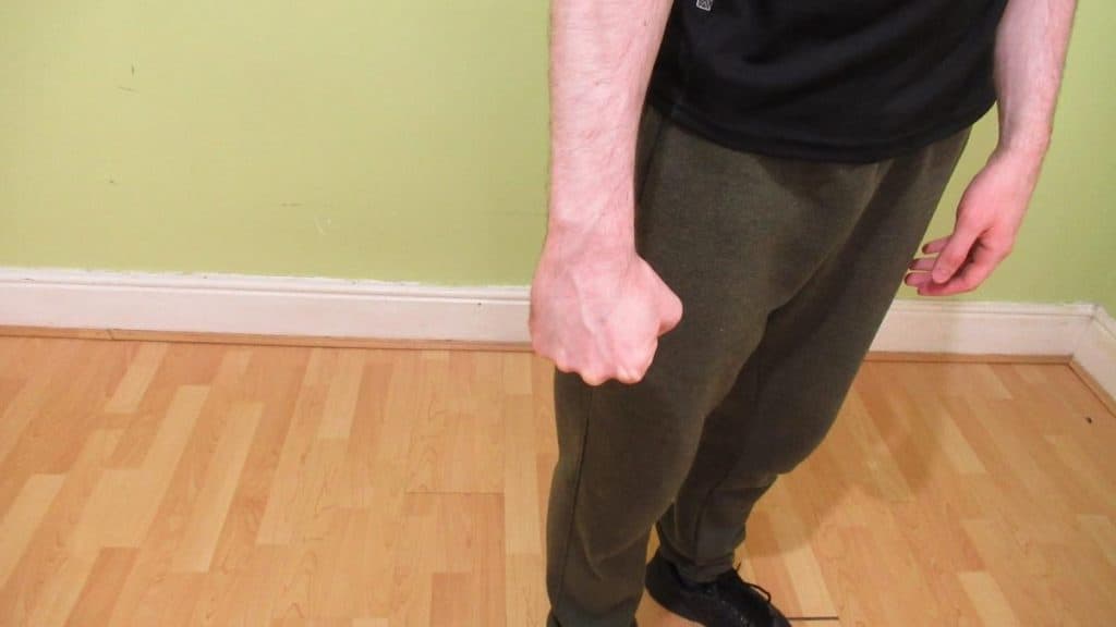 A man showing that he has a medium size wrist
