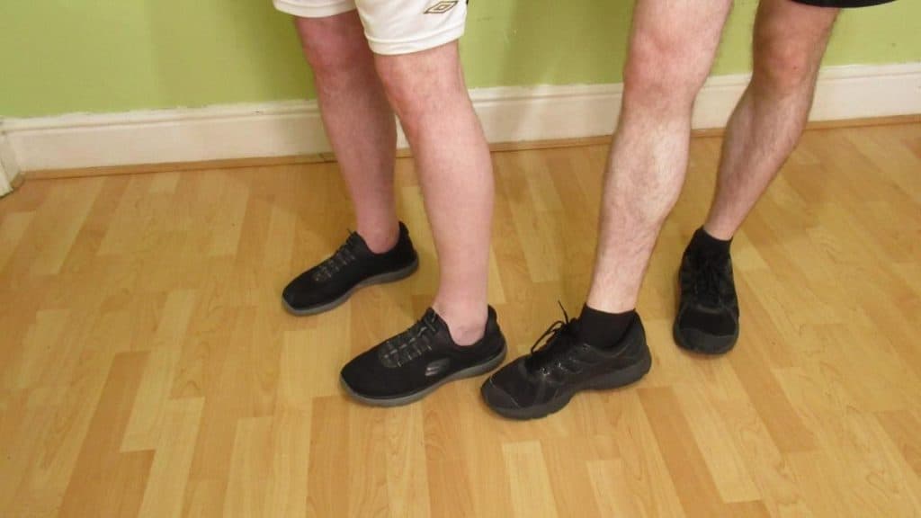 Two men showing the relationship between your ankle measurement and frame size