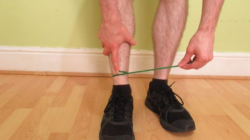 A man demonstrating how to measure your ankle size without a tape measure