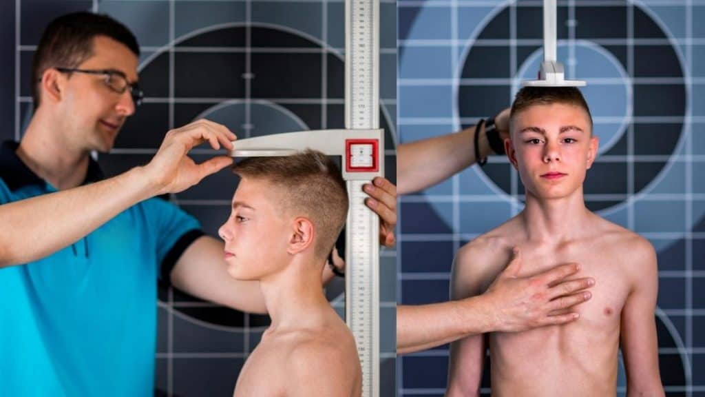 A boy getting measured to see if he has the average 16 year old height for males of his age