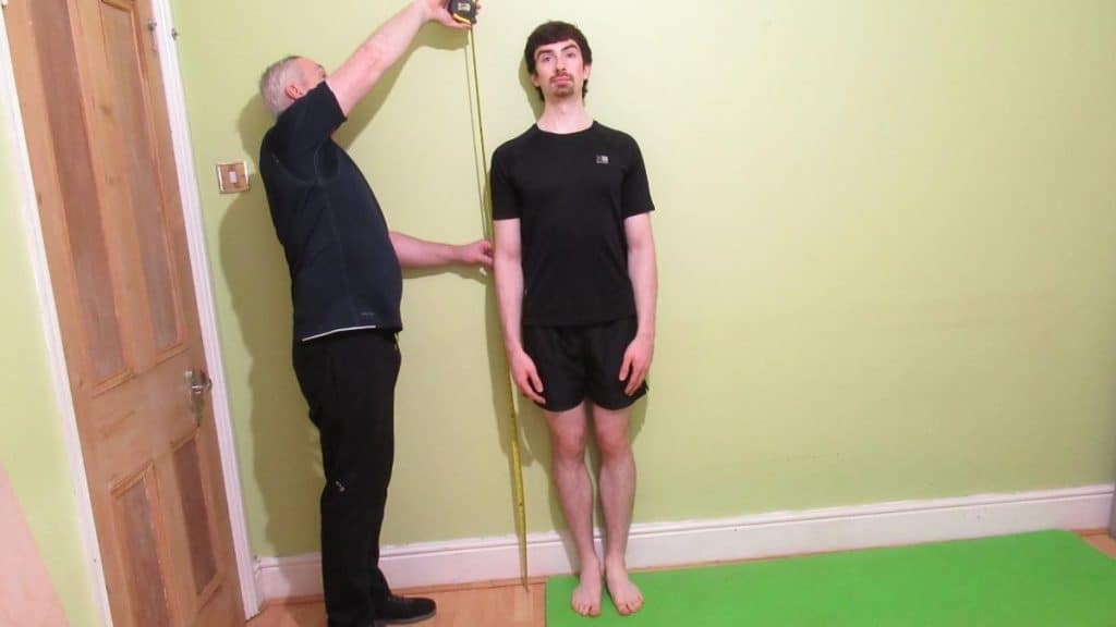 A man showing how to add 4 inches to your height