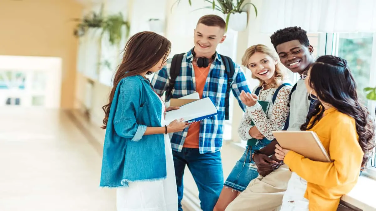 A group of freshman students talking to each other