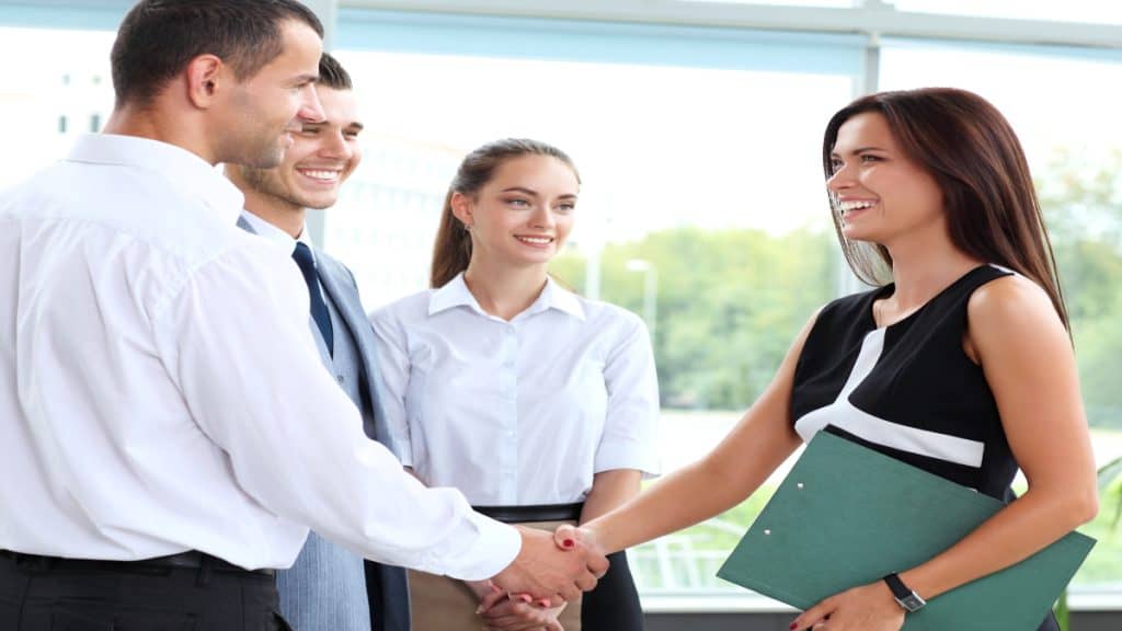 A man and woman shaking hands