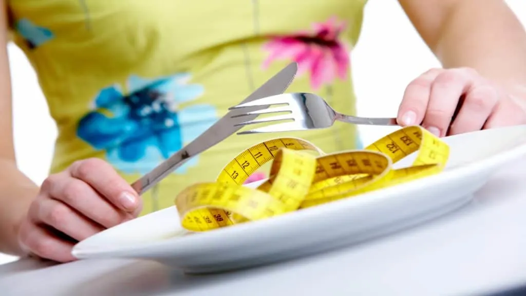 A person looking at their empty plate