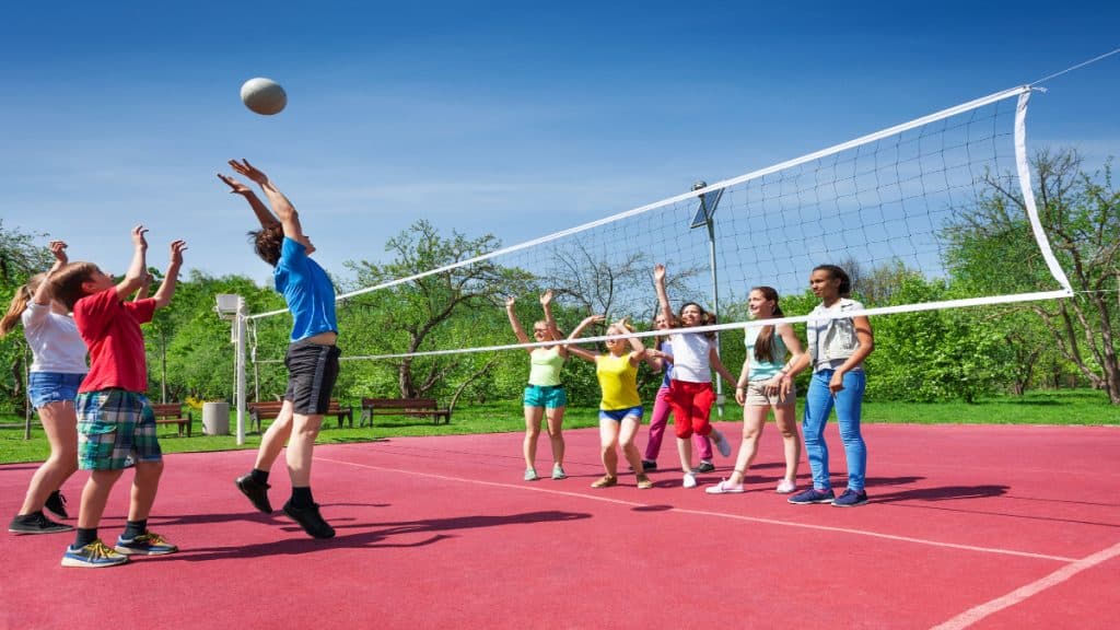 A group of children playing volleyball