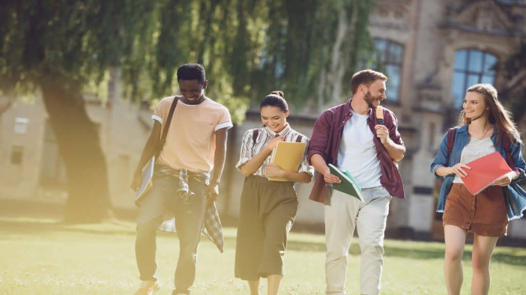 Some freshman students walking on campus