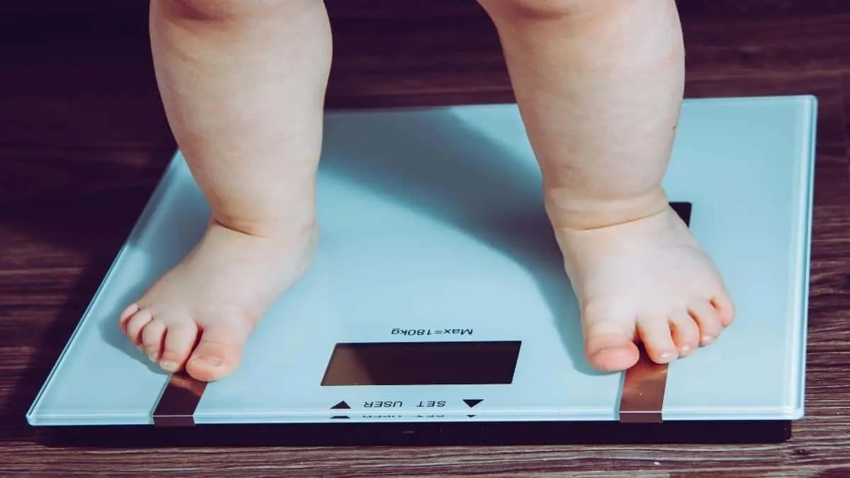 A person seeing how much a 1 year old should weigh