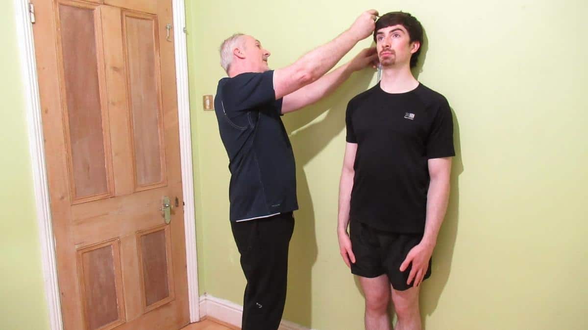 Two men demonstrating how to grow 3 cm taller