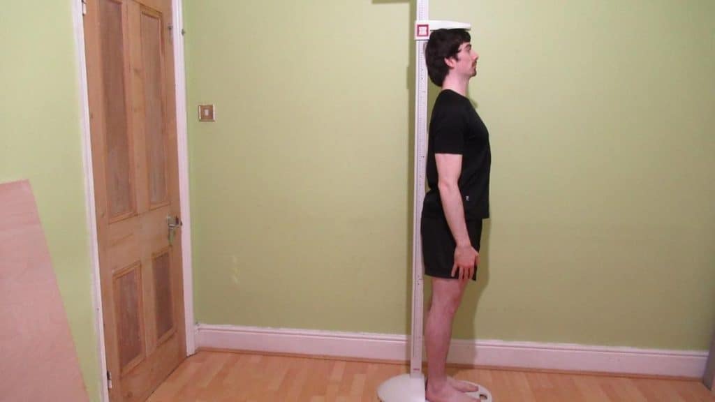 A man demonstrating how to grow one inch taller