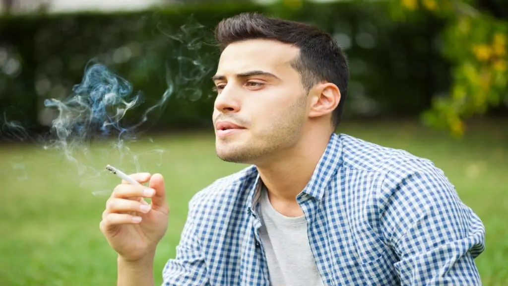 A man smoking a cigarette