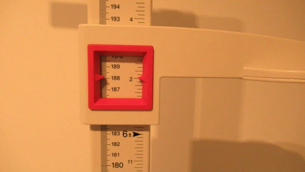 A stadiometer displaying the height 6 feet 2 inches