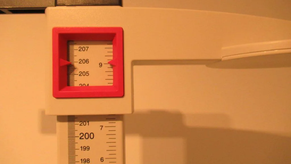 A stadiometer displaying the height 6 feet 9 inches