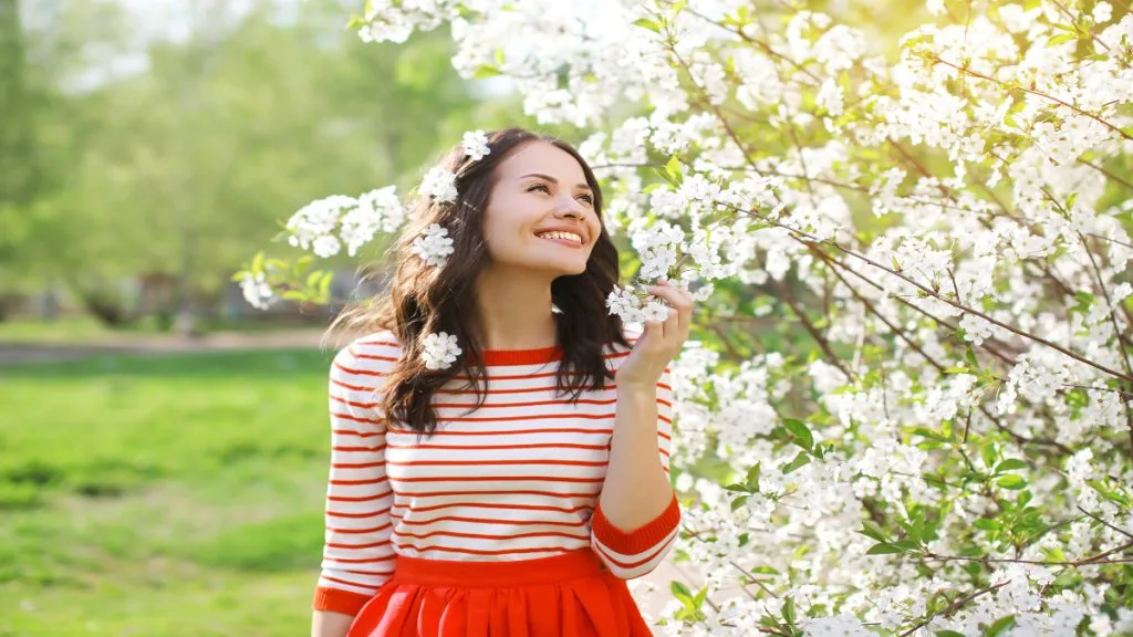 A cute tall girl walking in the park