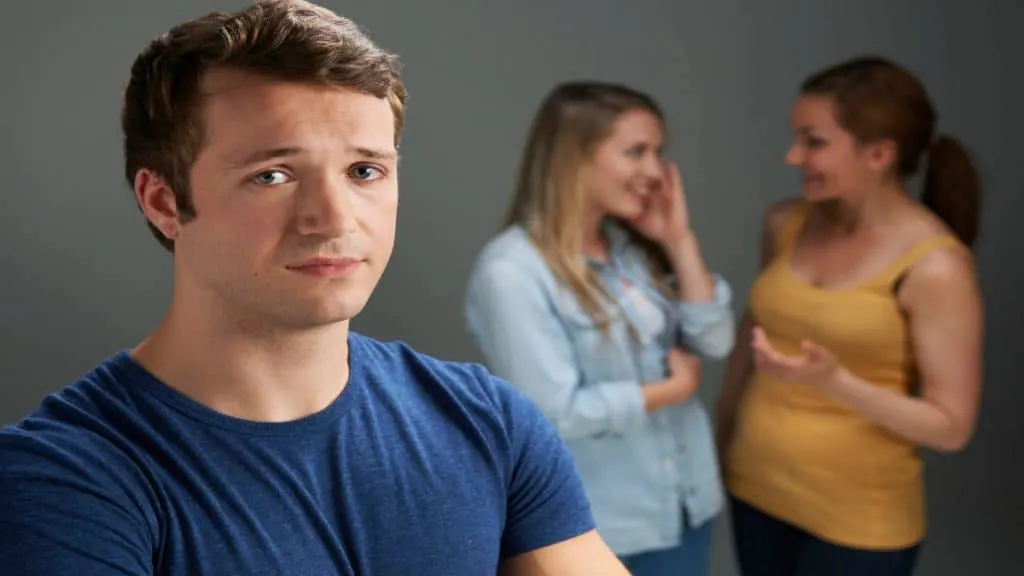 Two women gossiping about a guy