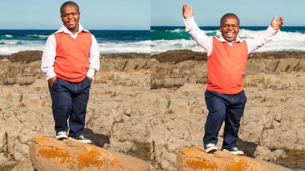 A happy little man at the beach