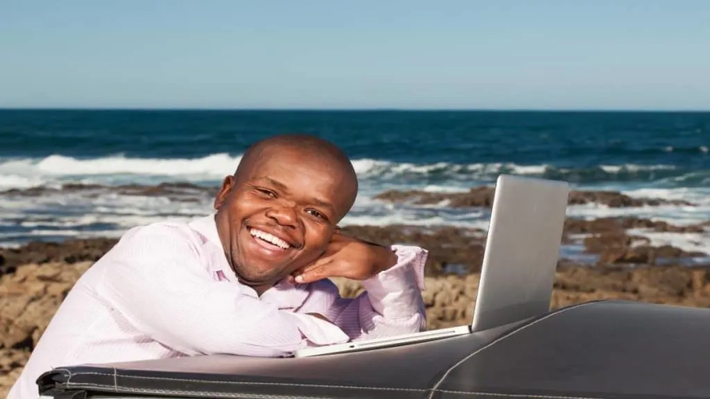 A happy man using his computer