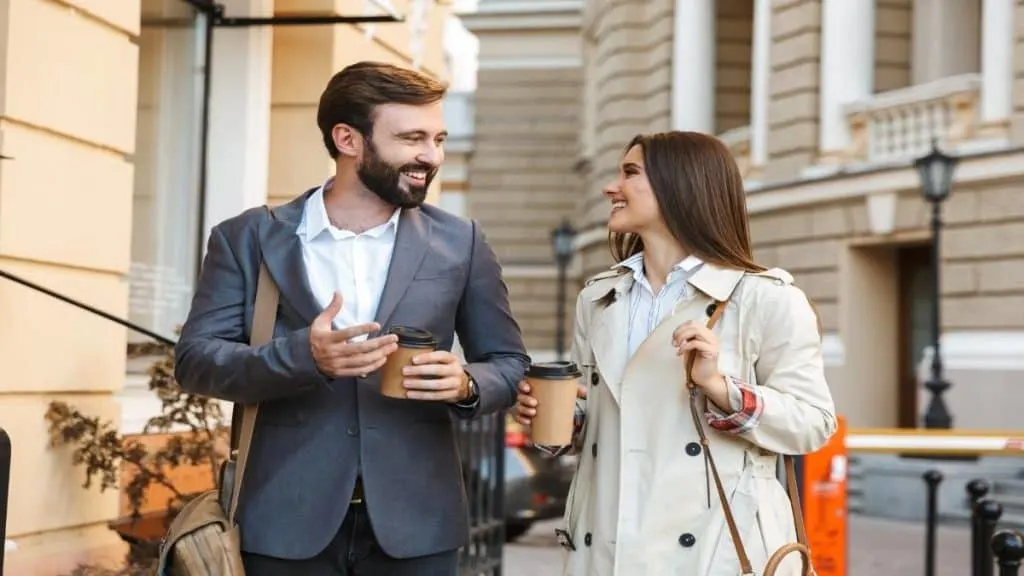 A man and a woman smiling at each other