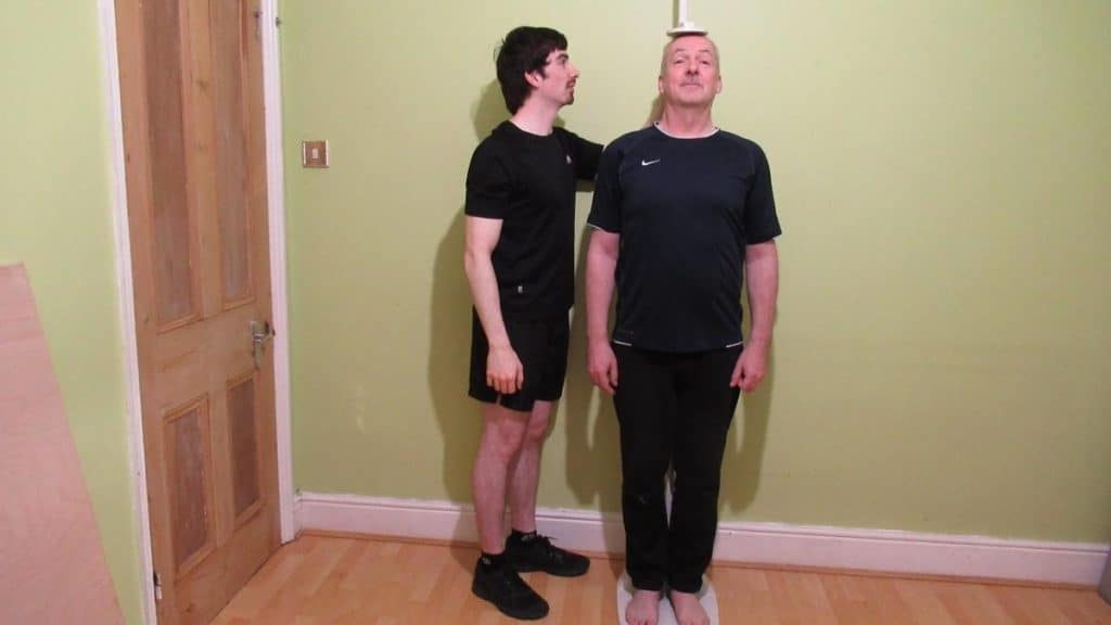 A man getting measured with a stadiometer