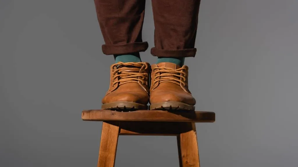 A man standing on a stool