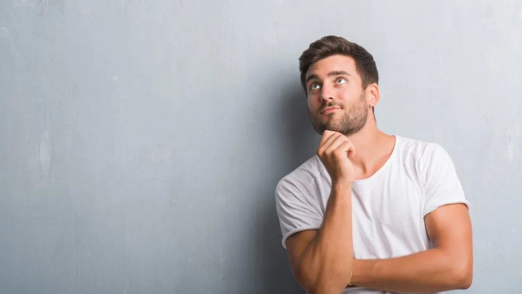 A man with a thoughtful expression on his face