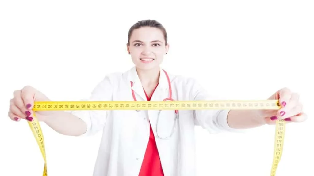 A woman holding a measuring tape