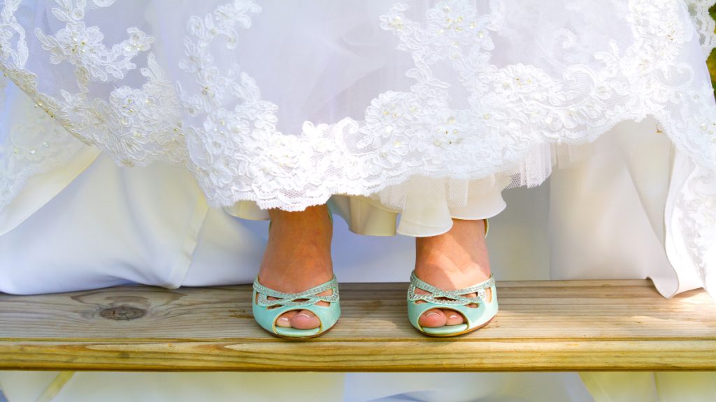 A woman wearing her wedding shoes