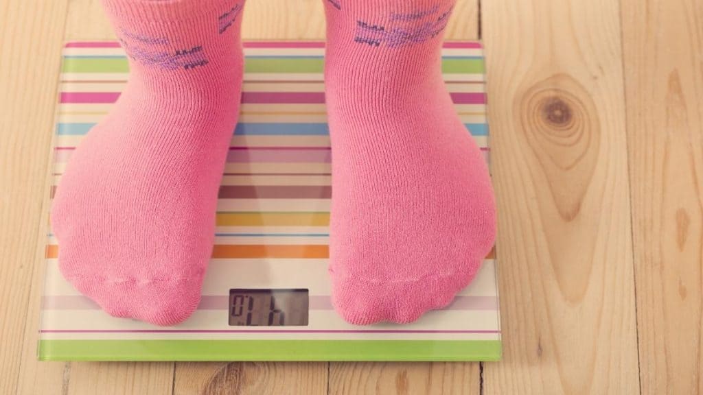 A woman stood on some weighing scales