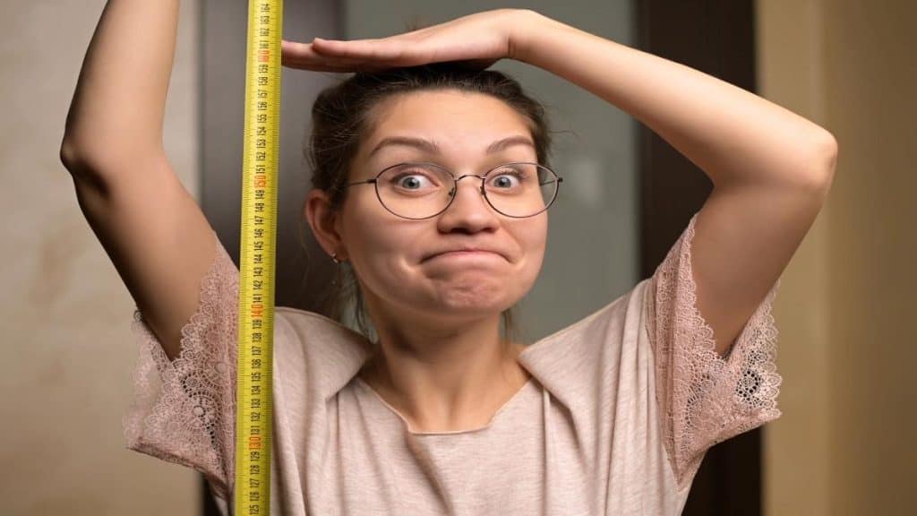 A woman measuring her height