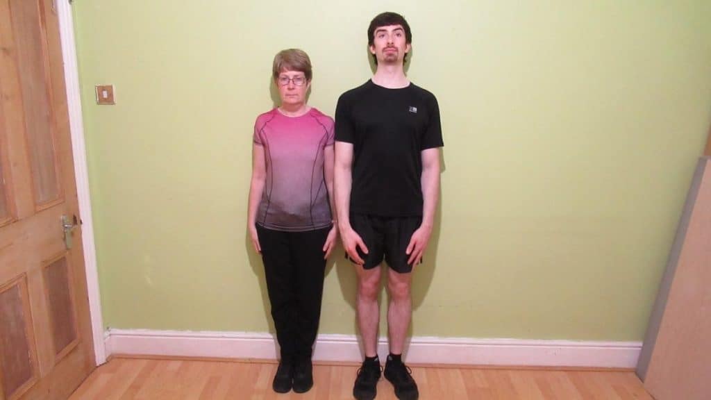 A woman standing next to a man