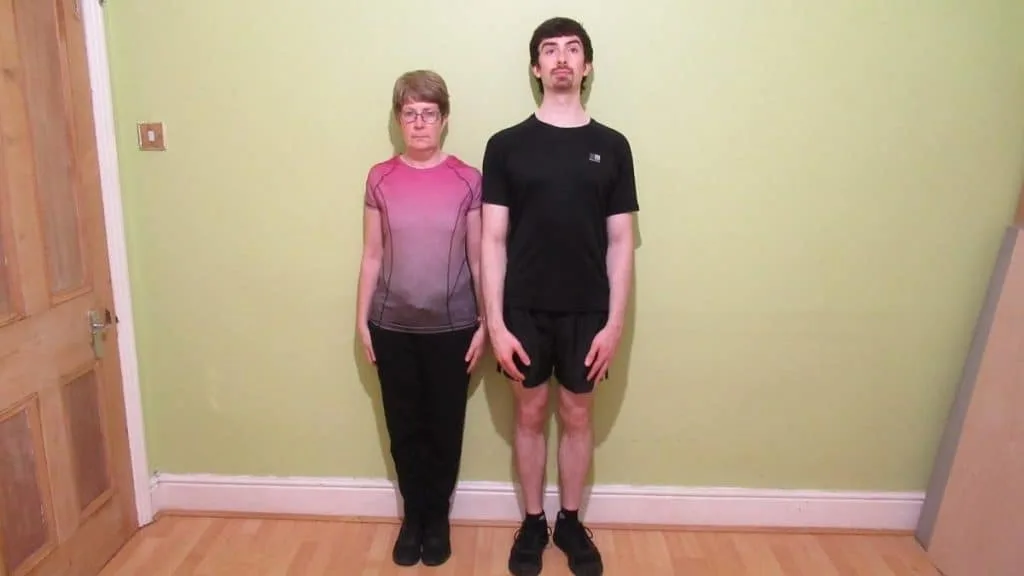 A woman standing next to a man