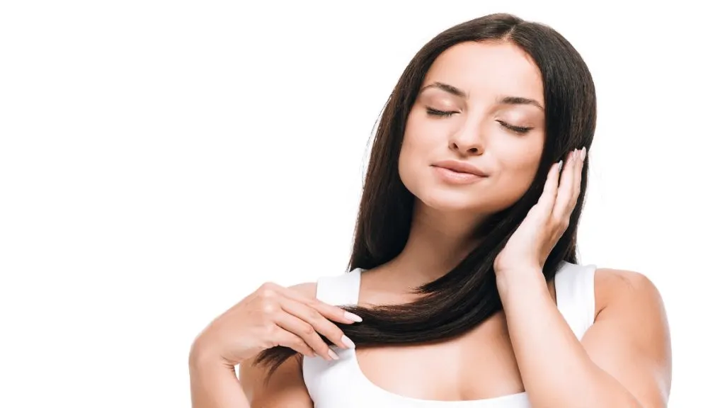 A woman touching her hair