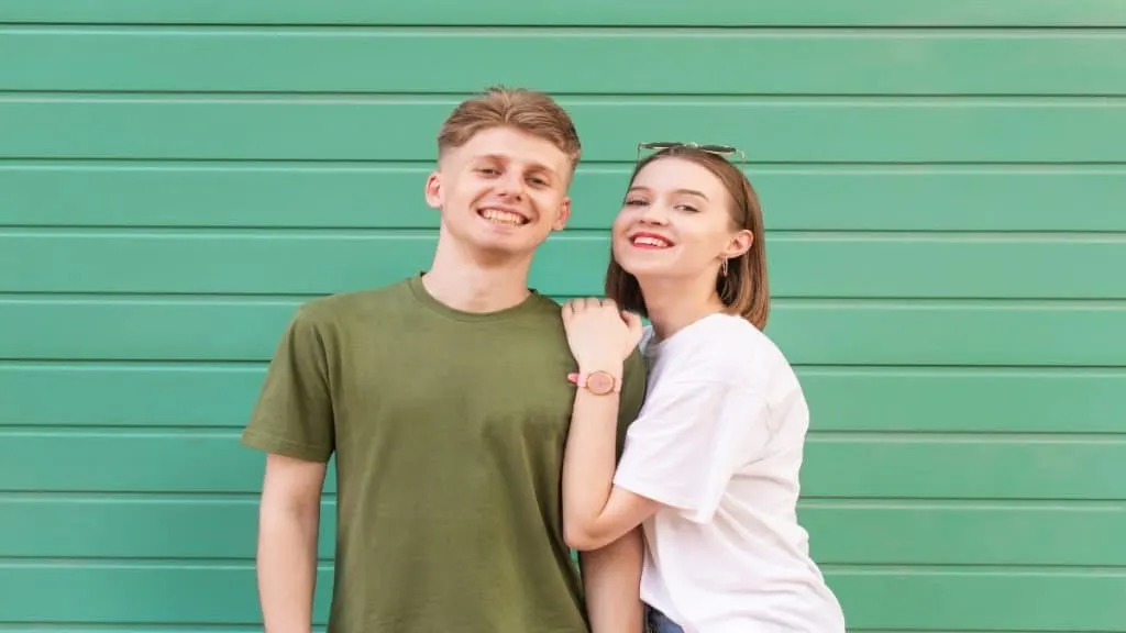 A young happy couple posing for the camera