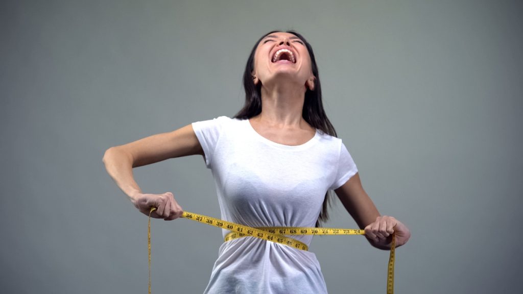 A woman wishing she had a BMI of 13.5