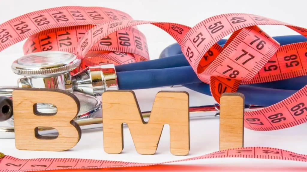 bmi in letters next to fitness gear