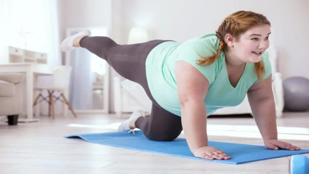 A female who has a BMI of 44 doing a workout