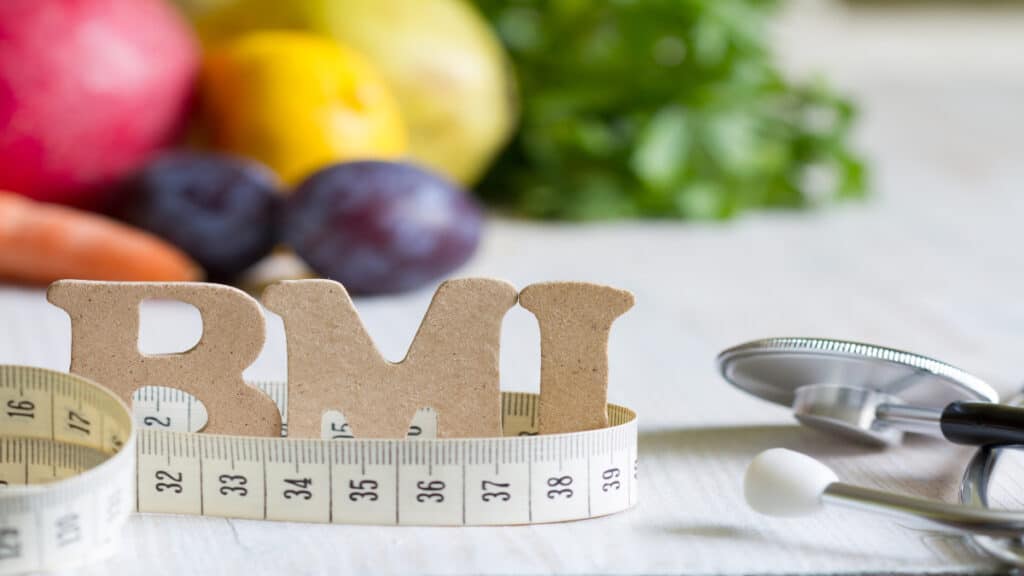 the word BMI next to a measuring tape
