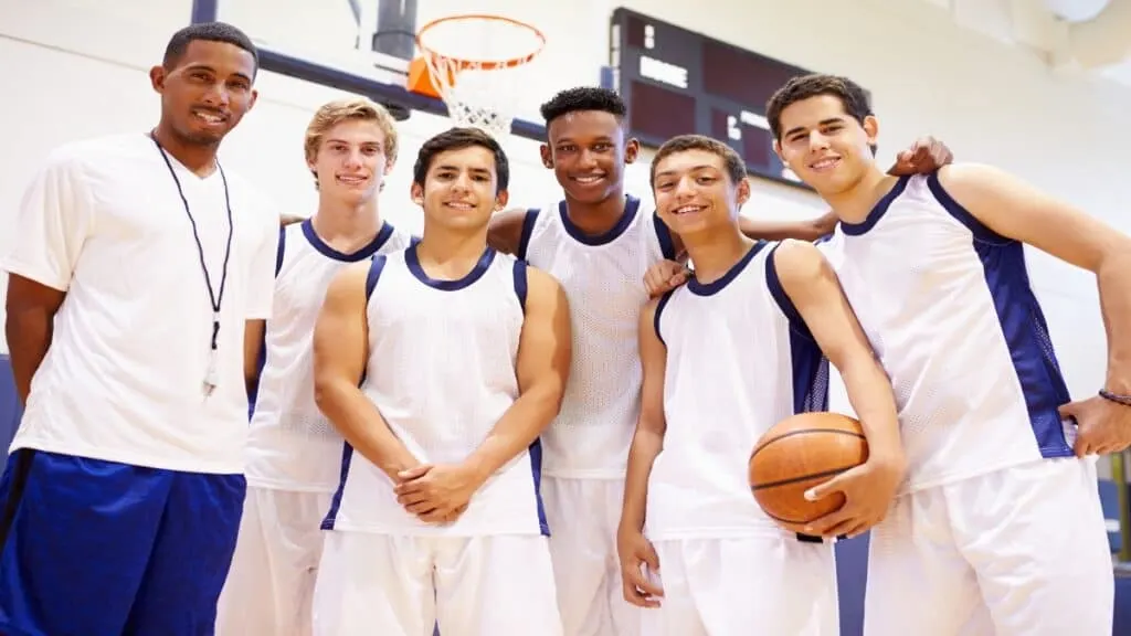 A group of 5'11 basketball players with their coach