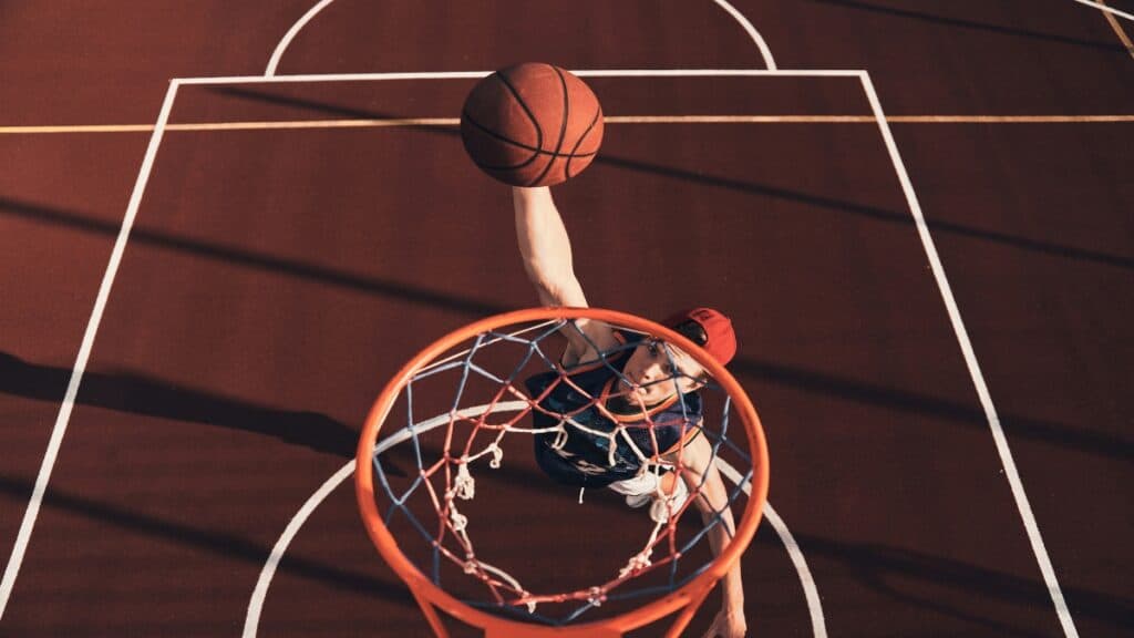A 5 11 NBA player dunking a basketball