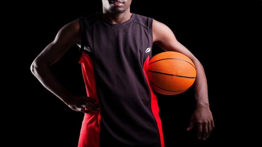 A 5 9 NBA player holding a basketball