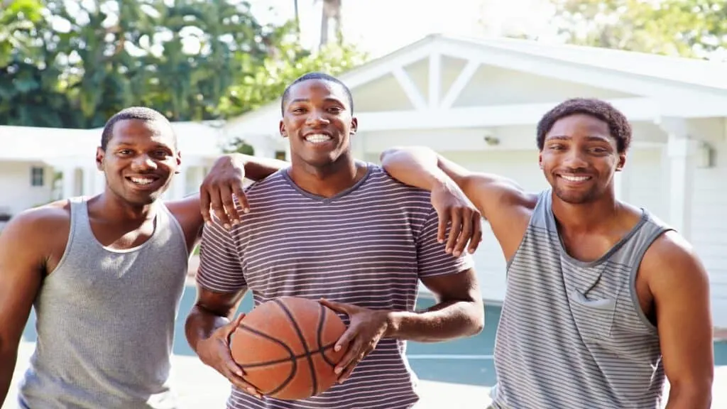 Some 6’6 basketball players holding the ball