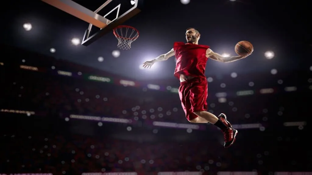 A 7’1 basketball player getting read to dunk