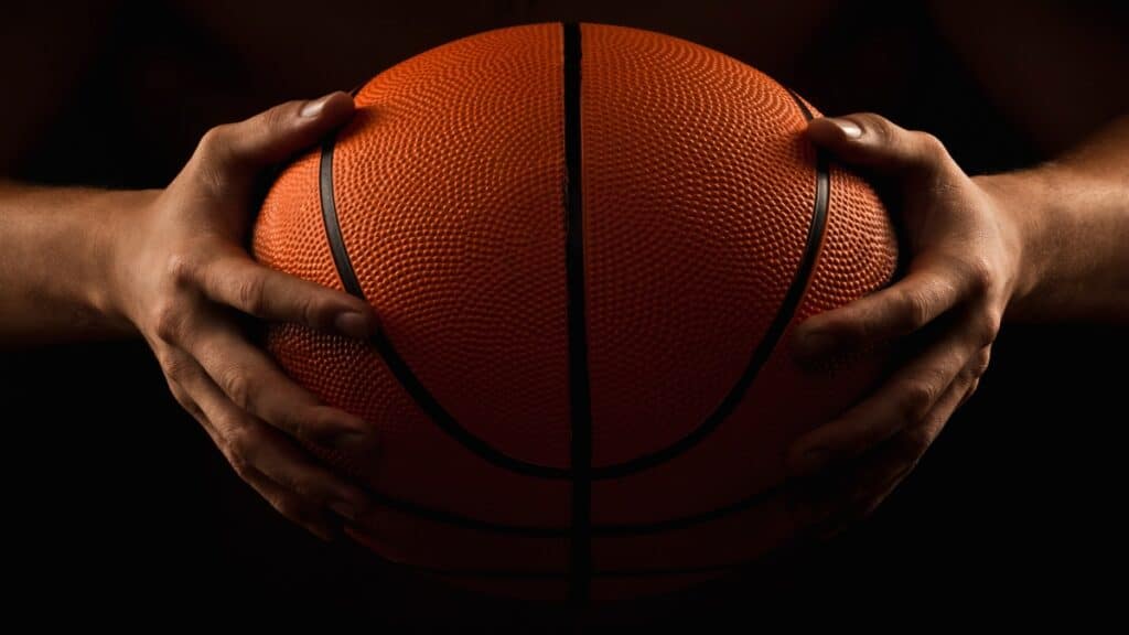 A 7 feet basketball holding a basketball